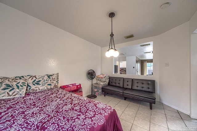 bedroom featuring tile patterned flooring, visible vents, and baseboards
