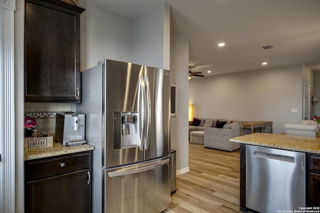 kitchen with light wood-style flooring, appliances with stainless steel finishes, visible vents, recessed lighting, and a ceiling fan