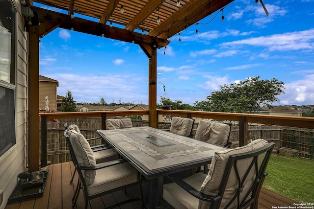 deck with fence, outdoor dining space, and a pergola