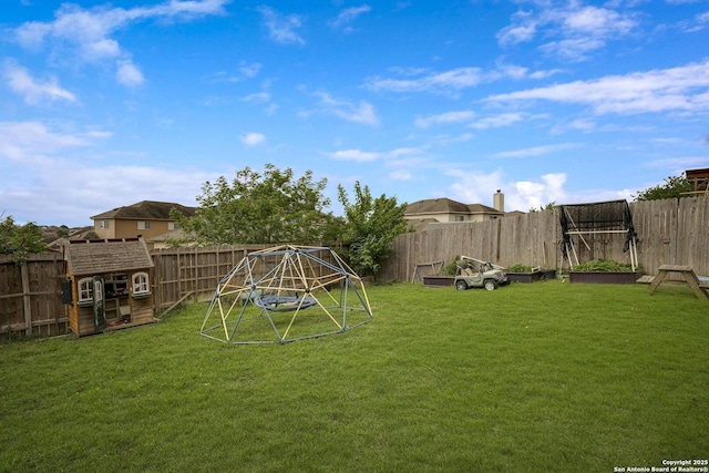 view of yard with a fenced backyard