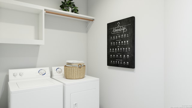 washroom with washer and clothes dryer and laundry area