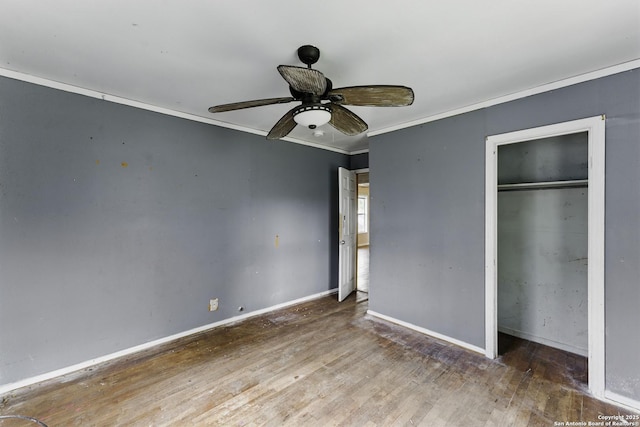 239 School Ave, New Braunfels, TX 78130 - unfurnished bedroom featuring a closet, ceiling fan, baseboards, ornamental molding, and wood finished floors