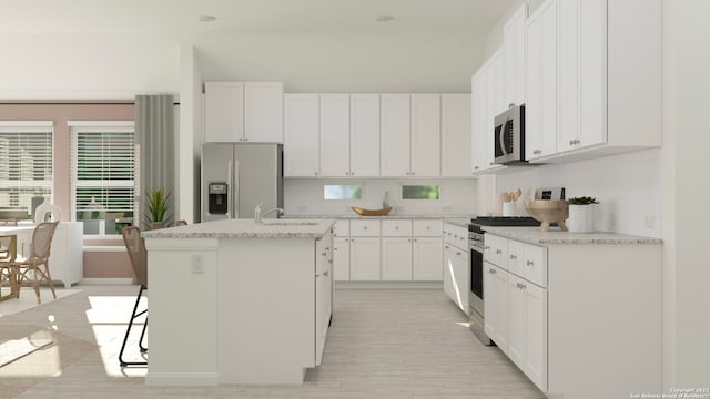 kitchen featuring a kitchen island with sink, decorative backsplash, appliances with stainless steel finishes, a sink, and white cabinetry