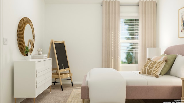 carpeted bedroom with baseboards