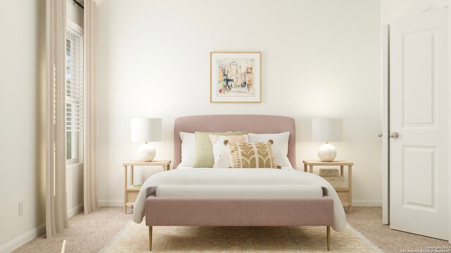 bedroom with carpet flooring and baseboards