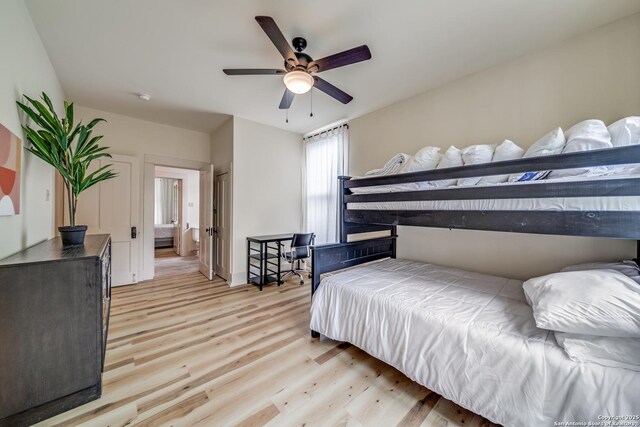 bedroom featuring a ceiling fan and light wood finished floors