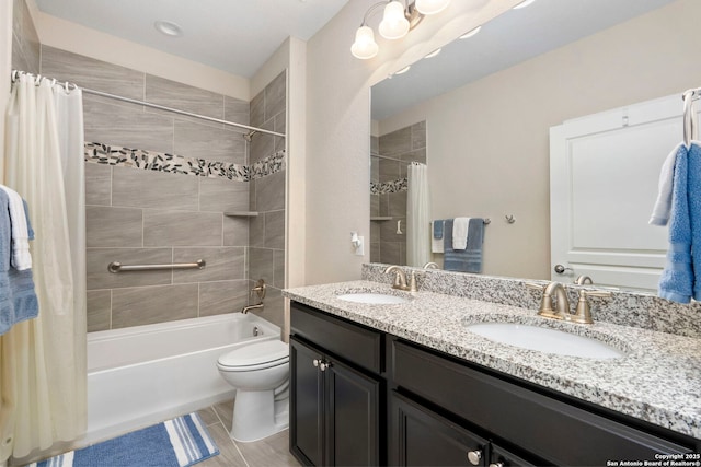 full bath with a sink, shower / bath combo, toilet, and double vanity