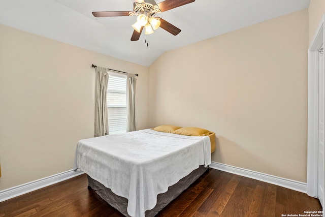 bedroom featuring baseboards, dark wood finished floors, ceiling fan, and lofted ceiling