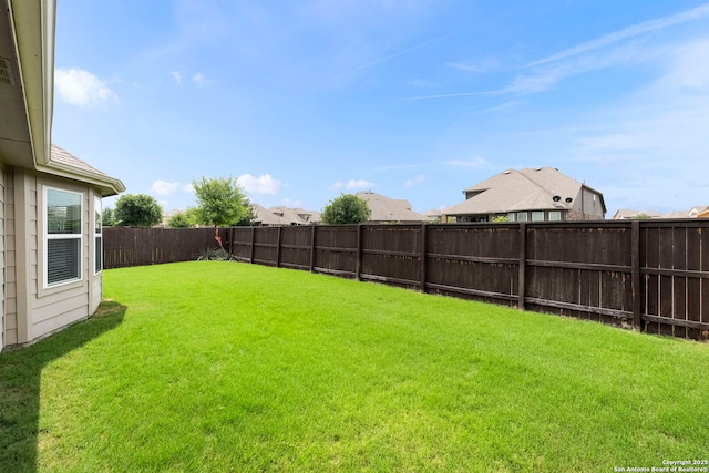view of yard featuring a fenced backyard