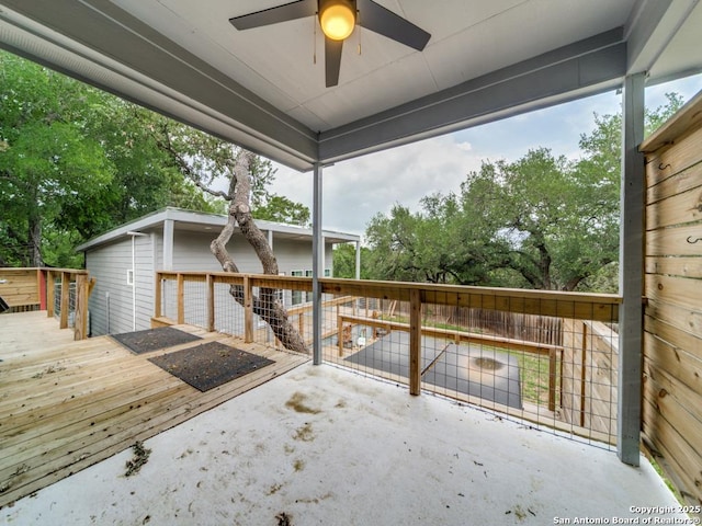 exterior space with a wooden deck and ceiling fan