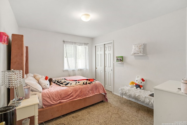 carpeted bedroom with a closet