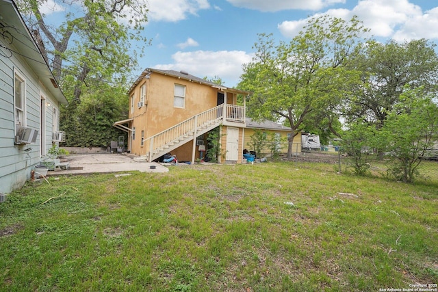 view of yard with cooling unit, a patio, stairs, and fence