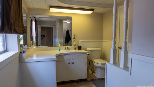 4843 Fm 1436, La Pryor, TX 78872 - bathroom with vanity, toilet, and a paneled ceiling