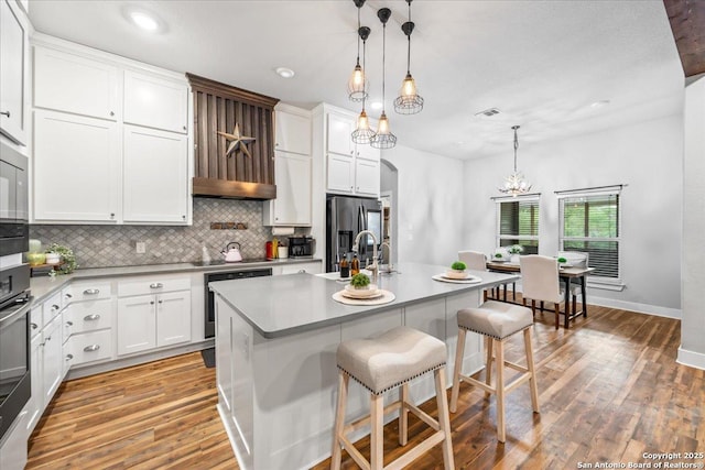 1547 Moon Vw, New Braunfels, TX 78132 - kitchen featuring appliances with stainless steel finishes, backsplash, light wood-style floors, white cabinetry, and recessed lighting