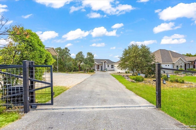 1547 Moon Vw, New Braunfels, TX 78132 - view of front of property featuring driveway, a front yard, and a gate
