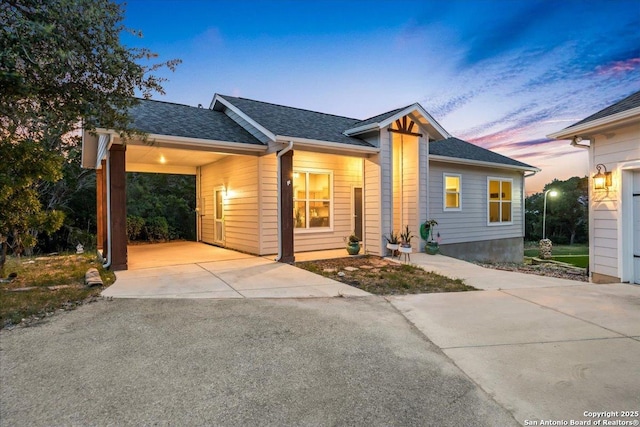 1547 Moon Vw, New Braunfels, TX 78132 - view of front of house with driveway, roof with shingles, and an attached carport