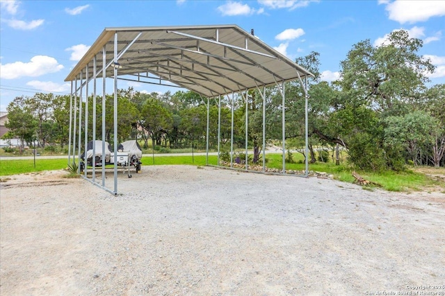 1547 Moon Vw, New Braunfels, TX 78132 - view of home's community featuring a detached carport, driveway, and view of wooded area