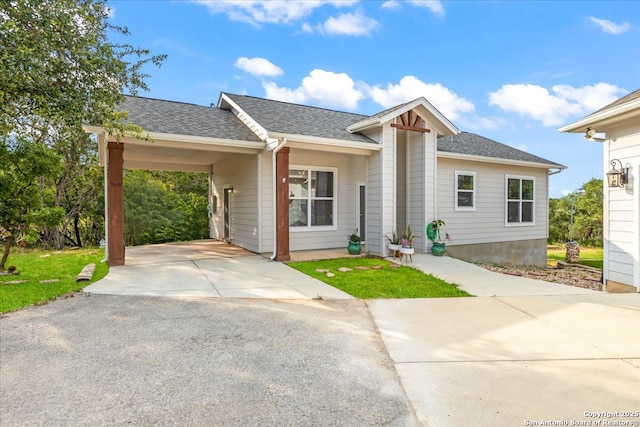 1547 Moon Vw, New Braunfels, TX 78132 - view of front of house with asphalt driveway, roof with shingles, and an attached carport