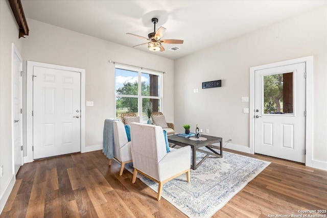 1547 Moon Vw, New Braunfels, TX 78132 - living area featuring a ceiling fan, wood finished floors, and baseboards
