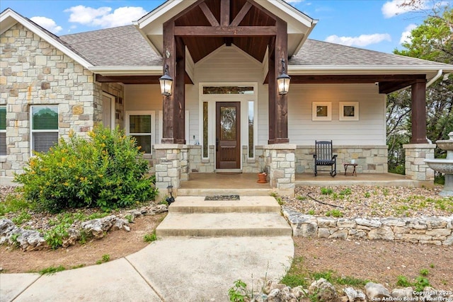 1547 Moon Vw, New Braunfels, TX 78132 - doorway to property with stone siding, roof with shingles, and a porch
