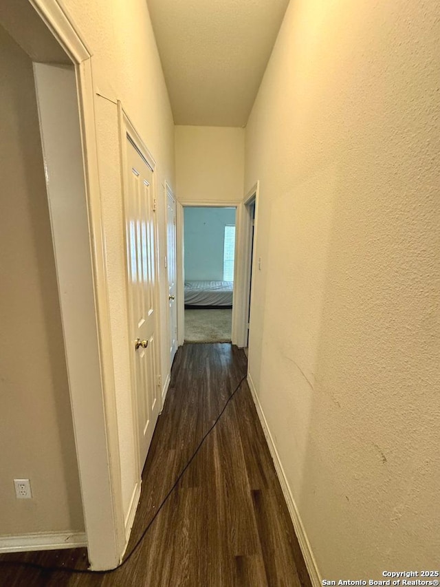 607 Dover Ln, Round Rock, TX 78664 - hallway featuring dark wood finished floors and baseboards