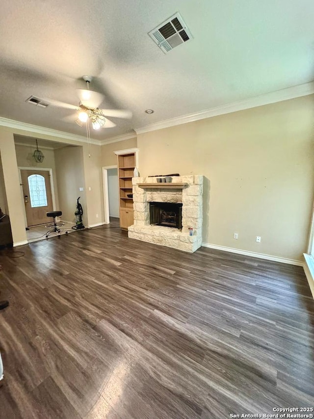 607 Dover Ln, Round Rock, TX 78664 - unfurnished living room with baseboards, visible vents, a fireplace, and crown molding