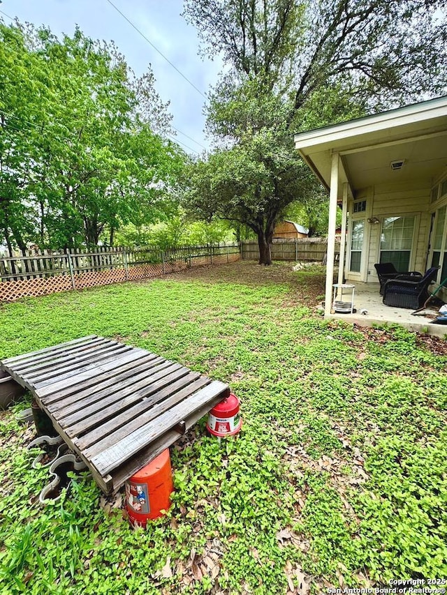 607 Dover Ln, Round Rock, TX 78664 - view of yard featuring a patio and a fenced backyard