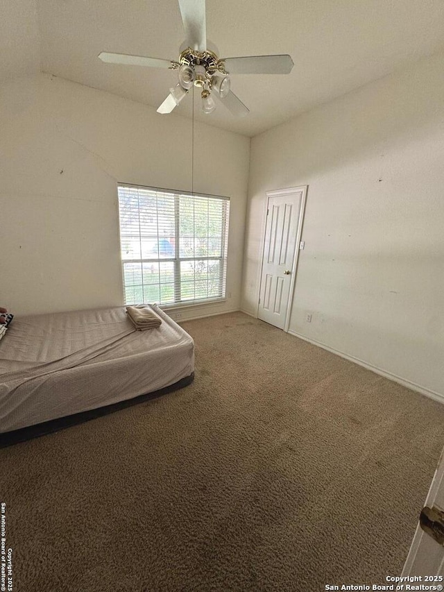 607 Dover Ln, Round Rock, TX 78664 - unfurnished bedroom featuring lofted ceiling, ceiling fan, and carpet