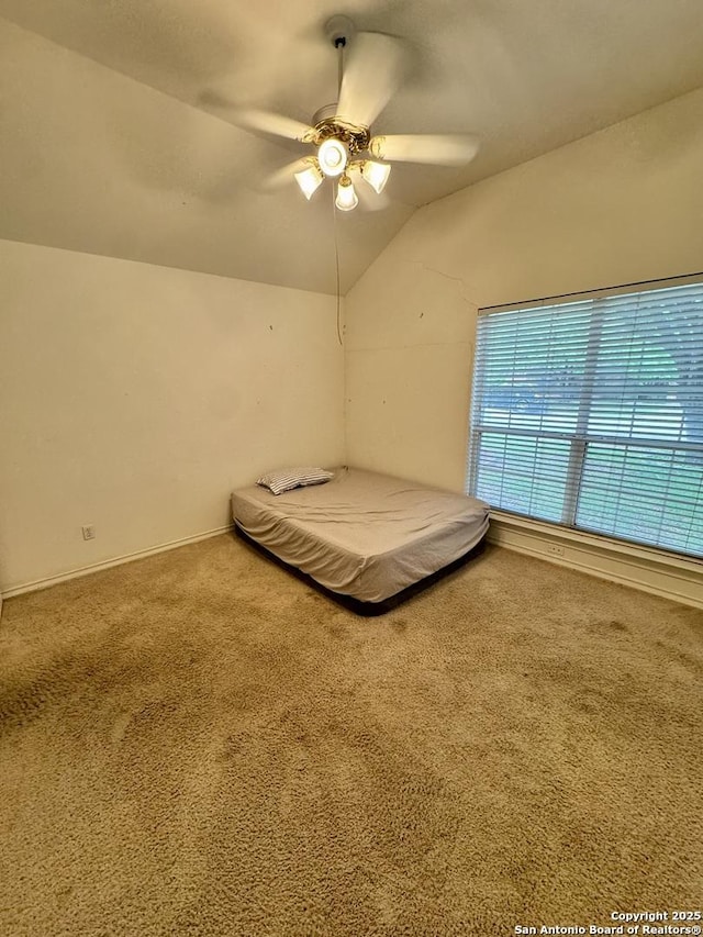 607 Dover Ln, Round Rock, TX 78664 - bedroom with baseboards, ceiling fan, carpet floors, and lofted ceiling