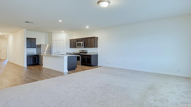 13406 Flower Pond, Saint Hedwig, TX 78152 - kitchen with visible vents, an island with sink, open floor plan, and appliances with stainless steel finishes