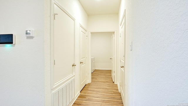 13406 Flower Pond, Saint Hedwig, TX 78152 - hall with visible vents, light wood-style flooring, and a textured wall