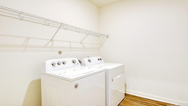 13406 Flower Pond, Saint Hedwig, TX 78152 - laundry room featuring independent washer and dryer, light wood-type flooring, laundry area, and baseboards