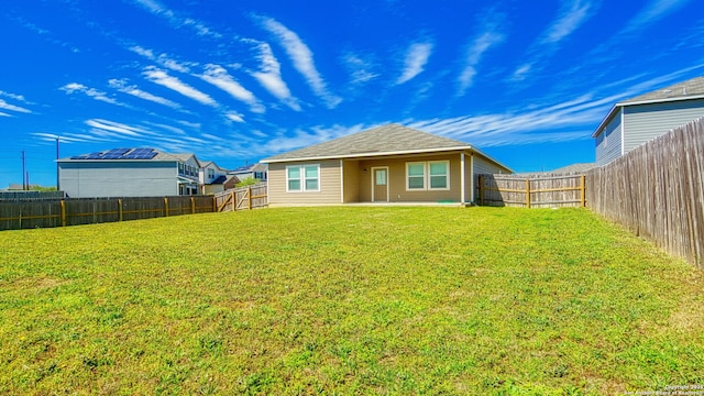 13406 Flower Pond, Saint Hedwig, TX 78152 - back of property featuring a yard, a patio area, and a fenced backyard