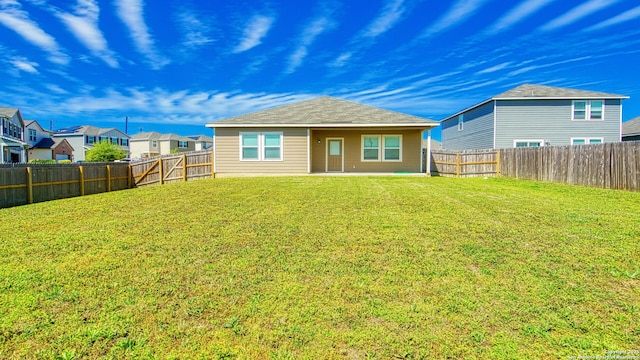 13406 Flower Pond, Saint Hedwig, TX 78152 - back of house with a fenced backyard and a lawn