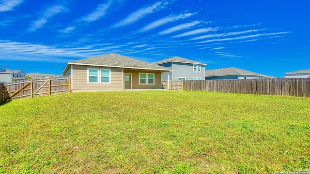 13406 Flower Pond, Saint Hedwig, TX 78152 - back of house featuring a lawn and a fenced backyard