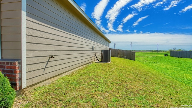 13406 Flower Pond, Saint Hedwig, TX 78152 - view of property exterior with fence, central AC unit, and a yard