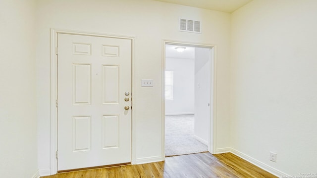 13406 Flower Pond, Saint Hedwig, TX 78152 - entrance foyer featuring baseboards, visible vents, and light wood finished floors