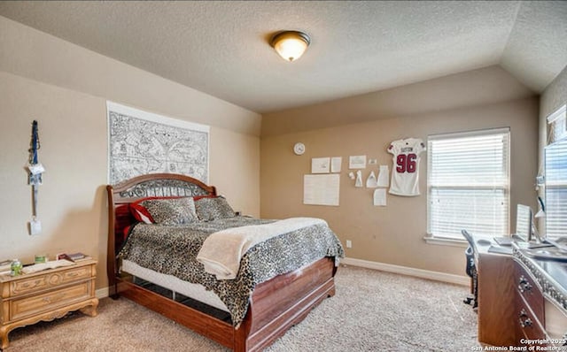 bedroom with a textured ceiling, light carpet, and baseboards