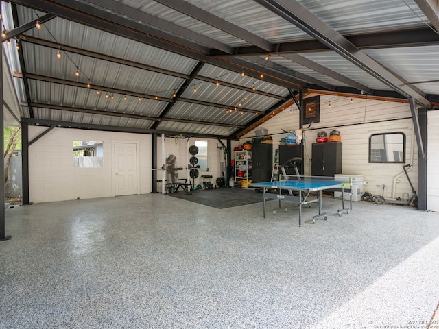 garage with concrete block wall