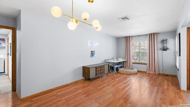 8422 Timber Crst, San Antonio, TX 78250 - dining room featuring a chandelier, visible vents, light wood-style flooring, and baseboards