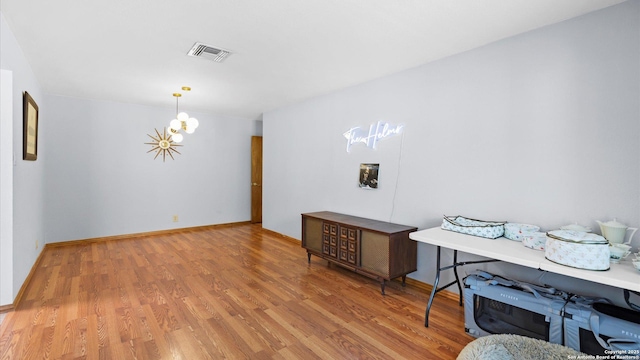 8422 Timber Crst, San Antonio, TX 78250 - interior space featuring visible vents, a chandelier, wood finished floors, and baseboards