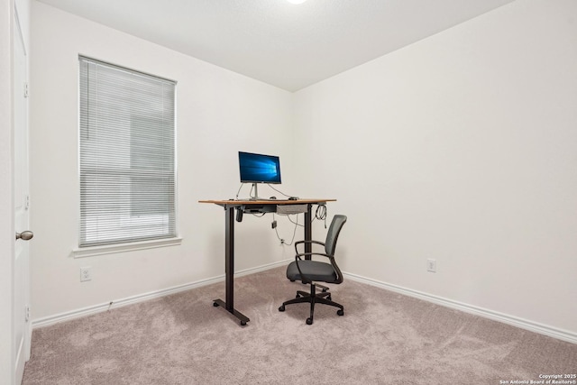 unfurnished office with carpet floors and baseboards