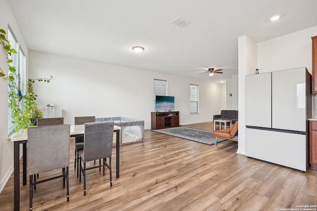 dining area featuring visible vents, a ceiling fan, light wood-style flooring, and recessed lighting