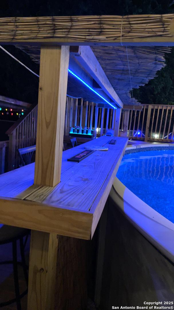 outdoor pool with a hot tub