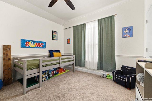 bedroom featuring ceiling fan, lofted ceiling, and carpet flooring