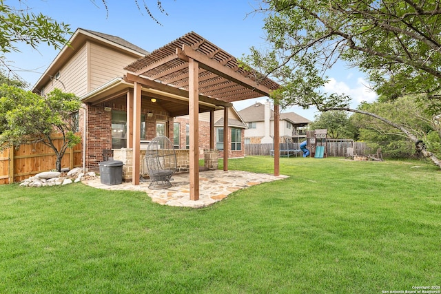 view of yard with a fenced backyard, a pergola, a playground, and a patio area
