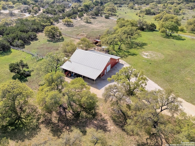 birds eye view of property with a rural view