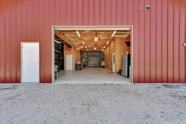 garage with freestanding refrigerator