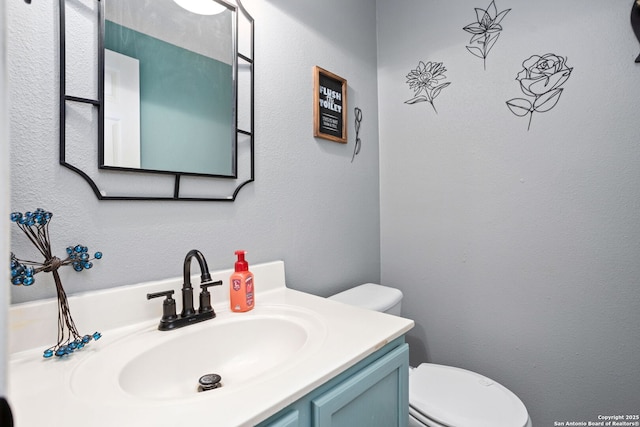 half bath with toilet and vanity