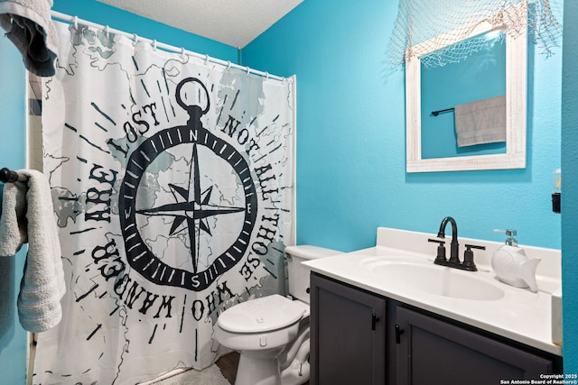 bathroom featuring curtained shower, toilet, a textured wall, and vanity